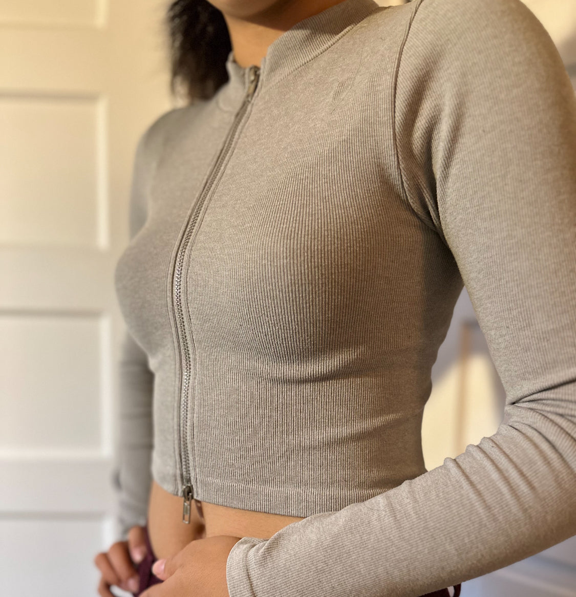 Cute ribbed knit crop top with zipper up the front.