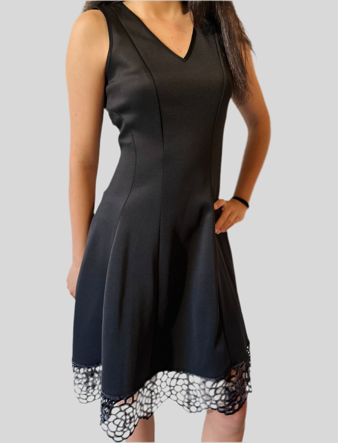 Black v neck dress with lace hem.