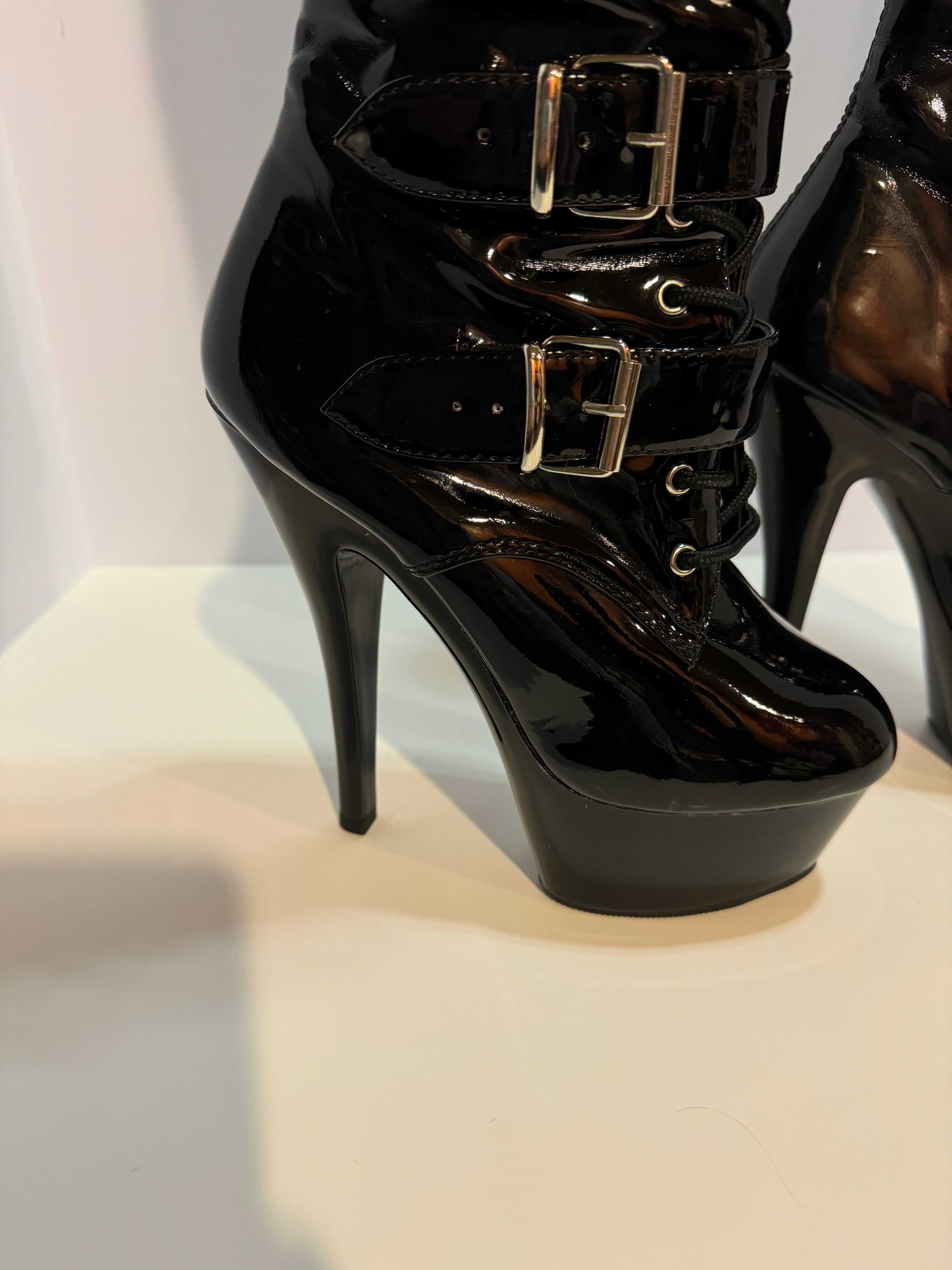 Gorgeous lace up, zipper, buckle, wedge high heel boots .